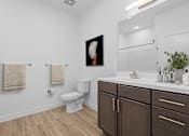 Thumbnail 15 of 16 - Bathroom with a toilet and sink at 36N Apartments, Tulsa, OK, 74106