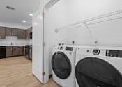 Thumbnail 16 of 16 - Laundry room with a washer and dryer at 36N Apartments, Tulsa, OK