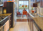 Thumbnail 5 of 64 - Apartment kitchen with stainless steel appliances and cabinets