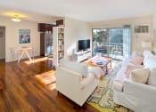 Thumbnail 10 of 64 - Apartment living room with private balcony and kitchen