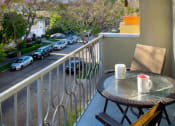 Thumbnail 14 of 64 - Apartment balcony with street and treetop views
