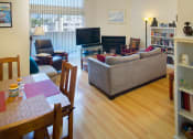 Thumbnail 18 of 64 - Apartment living room with private balcony, dining area