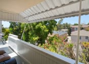 Thumbnail 27 of 64 - Apartment building balcony area with outdoor furniture
