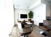Thumbnail 62 of 64 - Community lounge with furniture and television