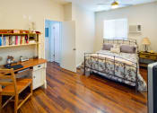 Thumbnail 22 of 64 - Apartment bedroom with ceiling fan and wood flooring
