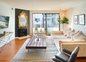 Thumbnail 38 of 64 - Apartment living room with fireplace and private balcony