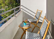 Thumbnail 41 of 64 - Apartment balcony with street and treetop views