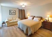 Thumbnail 32 of 64 - Apartment bedroom with wood flooring