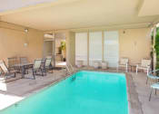 Thumbnail 33 of 64 - Community swimming pool with chairs