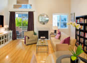 Thumbnail 44 of 64 - Apartment living room with fireplace and private balcony