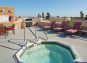 Thumbnail 48 of 64 - Community jacuzzi and BBQ/grill area with outdoor furniture