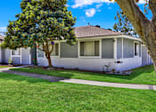 Thumbnail 8 of 31 - Corner residential building with landscaped front yard at Coventry Square Apartments, California, 97186