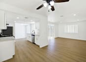 Thumbnail 17 of 31 - Open concept kitchen and living space with modern finishes at Coventry Square Apartments, California