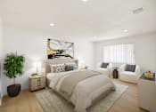 Thumbnail 1 of 31 - Furnished bedroom with neutral bedding and seating area at Coventry Square Apartments, Upland