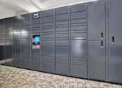 Thumbnail 9 of 23 - A row of dark grey lockers with a sign that says "hub" on the top left.