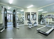 Thumbnail 12 of 25 - Fitness center with cardio equipment at Sunset Park Apartments, Seattle, WA, Washington
