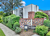 Thumbnail 19 of 28 - The Ridge at Bellingham is a modern building surrounded by greenery.