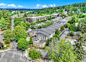 Thumbnail 4 of 23 - A view of a street with buildings and trees.