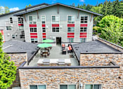 Thumbnail 2 of 23 - A building with a red and white striped wall.
