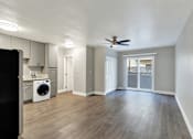 Thumbnail 5 of 25 - A room with a ceiling fan and a washing machine.at Federal Apartments, Los Angeles