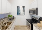 Thumbnail 7 of 10 - Updated Kitchen With Black Appliances at Oxnard Plaza, North Hollywood