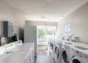 Thumbnail 3 of 60 - Washing machines in a laundromat at The Ridge at Bellevue, Bellevue, WA, 98005