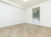 Thumbnail 23 of 52 - an empty room with a window and carpet  at Delano, Redmond, WA