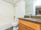 Thumbnail 28 of 52 - a bathroom with a sink toilet and a mirror  at Delano, Washington