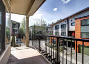 Thumbnail 29 of 52 - a balcony with a view of a courtyard and some buildings  at Delano, Washington, 98052