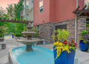 Thumbnail 16 of 52 - a fountain in front of a house with a swimming pool at Delano, Redmond, WA