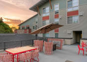 Thumbnail 18 of 52 - our apartments have a large patio with tables and chairs at Delano, Redmond Washington