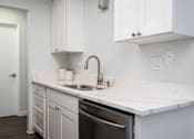 Thumbnail 42 of 60 - Kitchen with white counter tops and a sink at The Ridge at Bellevue, Bellevue, WA, 98005