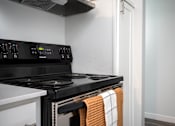 Thumbnail 38 of 60 - Kitchen with a stove and a microwave at The Ridge at Bellevue, Bellevue, Washington