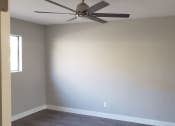 Thumbnail 4 of 12 - Bedroom with Window, Ceiling Fan, Hardwood Flooring at Wilson Apartments in Glendale, CA