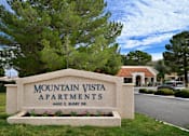 Thumbnail 1 of 35 - A sign for Mountain Vista Apartments is in front of a tree.
