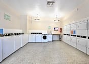 Thumbnail 11 of 35 - Laundry room with washers and dryers at Mountain Vista, Sierra Vista