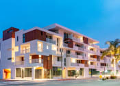 Thumbnail 1 of 11 - a rendering of a new apartment building on the corner of a street at The Lucky Apartments, Culver City, CA, 90066 