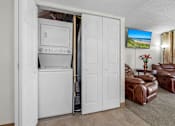 Thumbnail 14 of 16 - A white door is open to reveal a white oven and microwave.