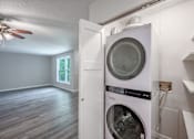 Thumbnail 7 of 8 - A washer and dryer are installed in a laundry room.