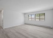 Thumbnail 12 of 22 - an empty room with a window and a door