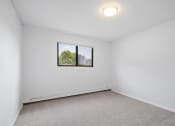 Thumbnail 14 of 22 - an empty room with white walls and a window