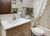 Thumbnail 8 of 14 - an image of a bathroom with a toilet and a sink
