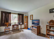 Thumbnail 7 of 14 - a living room filled with furniture and a tv