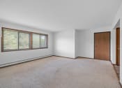 Thumbnail 4 of 22 - an empty living room with a large window and a door
