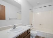 Thumbnail 7 of 22 - a bathroom with a sink toilet and a tub