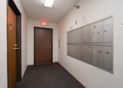 Thumbnail 5 of 27 - the lockers and the door to the locker room of a school