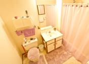 Thumbnail 13 of 14 - a bathroom with a sink and a toilet and a shower