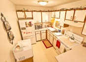 Thumbnail 9 of 14 - a kitchen with white appliances and white cabinets