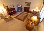 Thumbnail 11 of 14 - a living room filled with furniture and a piano