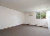 Thumbnail 7 of 21 - an empty room with white walls and a window